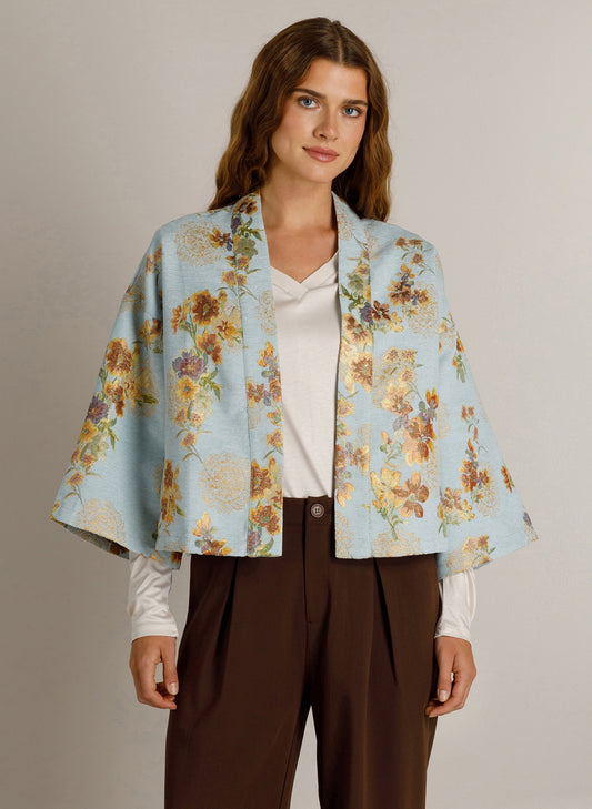 Vestjasje lichtblauw met bloemenprint, wijde mouwen en open voorpand