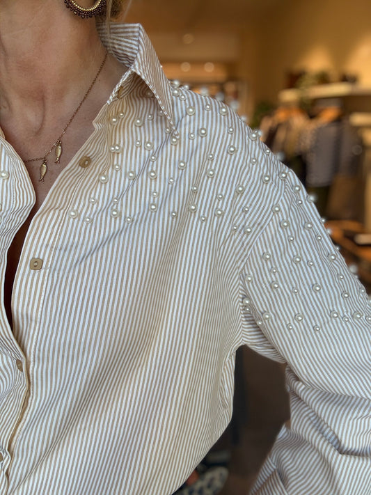 Gestreepte blouse met knoopsluiting, kraag en lange mouwen.
