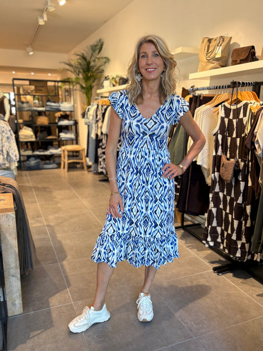 Blauwe midi-jurk met witte dierenprint, V-hals en korte pofmouwen met geplooide zoom