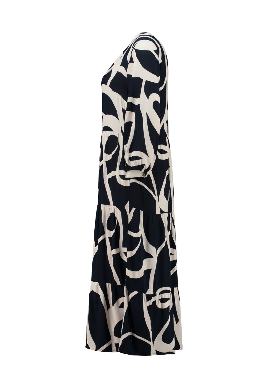 ZB Emira-jurk navy met abstract patroon, lange mouwen en losse vallende rok