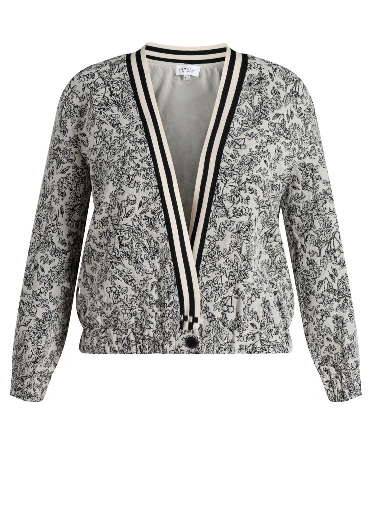 Cropped jasje met V-hals en zwarte knoopsluiting; zwart-wit bloemenprint en strepen